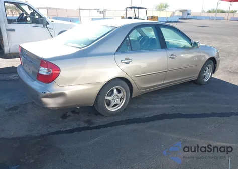 2002 Toyota Camry Le z USA, uszkodzony, nr VIN JTDBE32K120127837